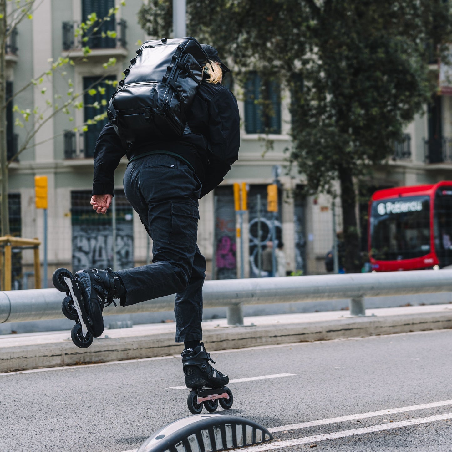 Person rollerblading on a city street with FlyingEagle RAPTOR T110 inline skates