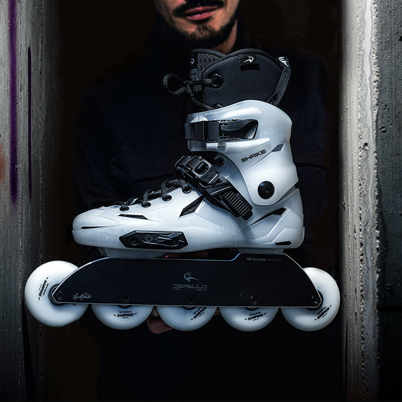 Man holding a pair of white FlyingEagle SHRIKE Pro R5