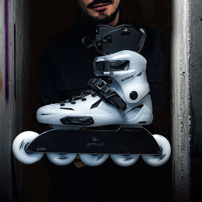 Man holding a pair of white FlyingEagle SHRIKE Pro R5