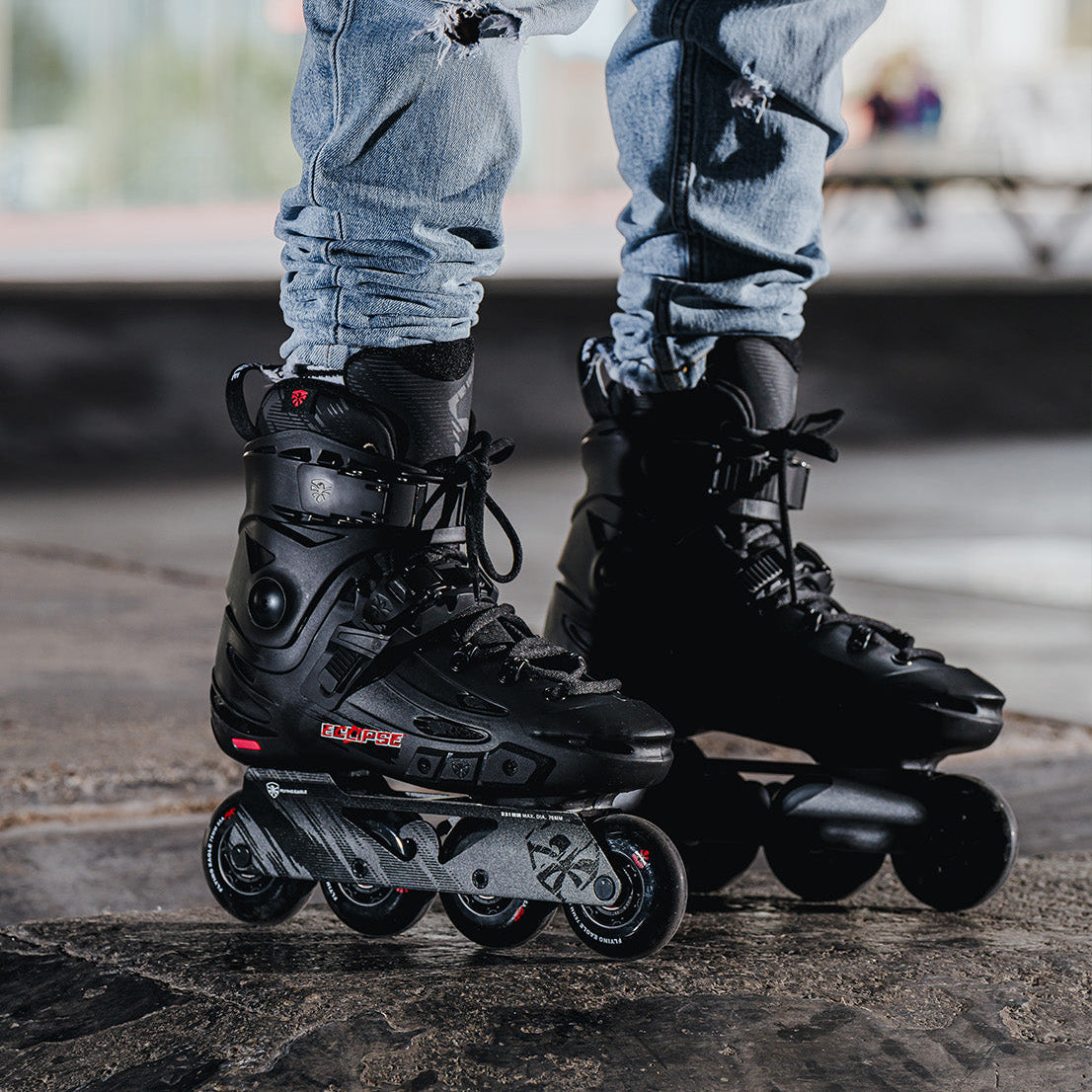 Person wearing black Flying Eagle Eclipse inline skates
