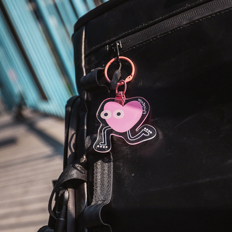 Black bag with a pink heart-shaped FlyingEagle keychain