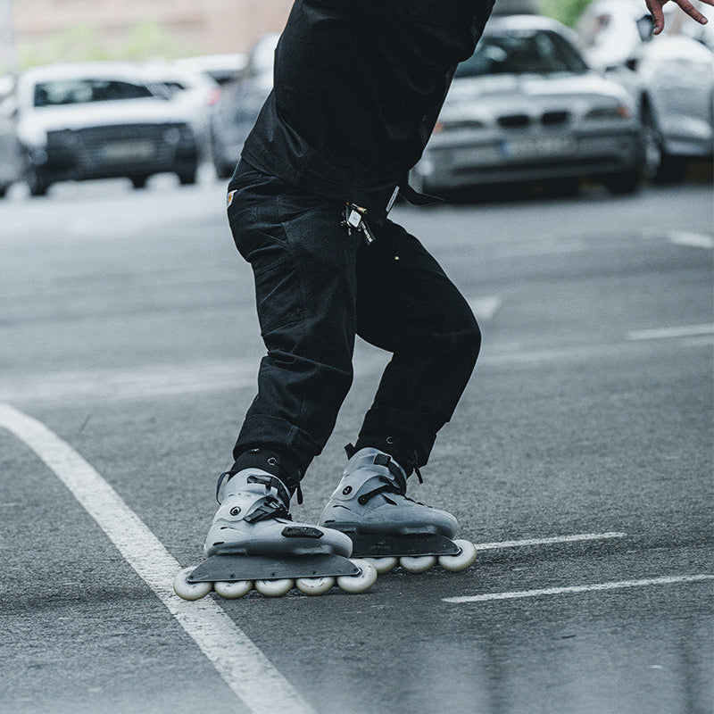 Skater practicing flatland moves with 5 wheels FlyingEagle SHRIKE Pro R5 outdoors