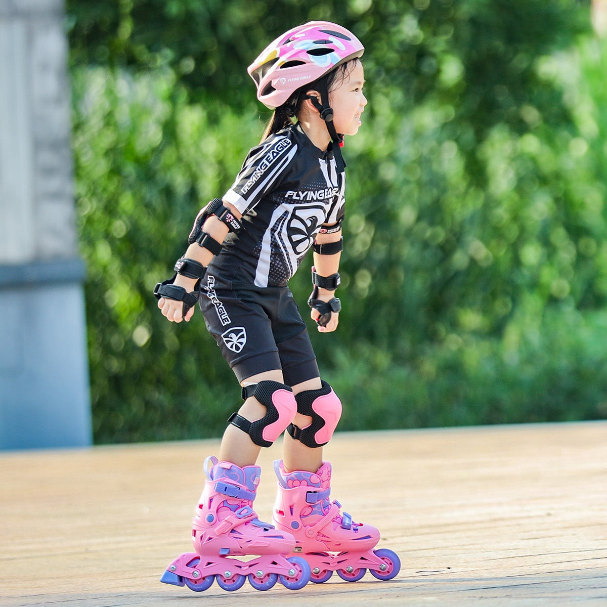 Child playing in park with size-adjustable FlyingEagle NACHT skates