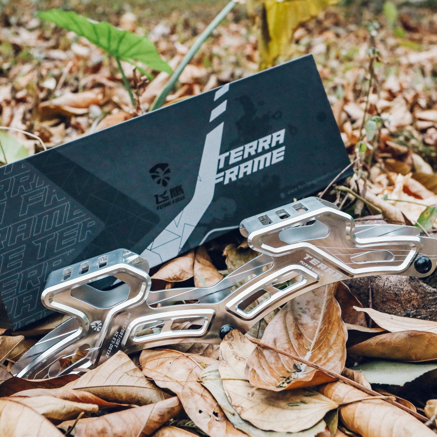 FlyingEagle TERRA FRAMES silver adult offroad frame set on a bed of leaves