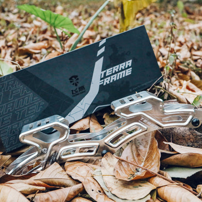 FlyingEagle TERRA FRAMES silver adult offroad frame set on a bed of leaves