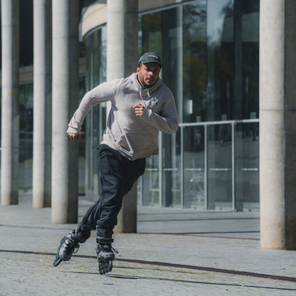 Urban skater speeding on pavement with FlyingEagle FALCON Pro titanium 20-year edition skate
