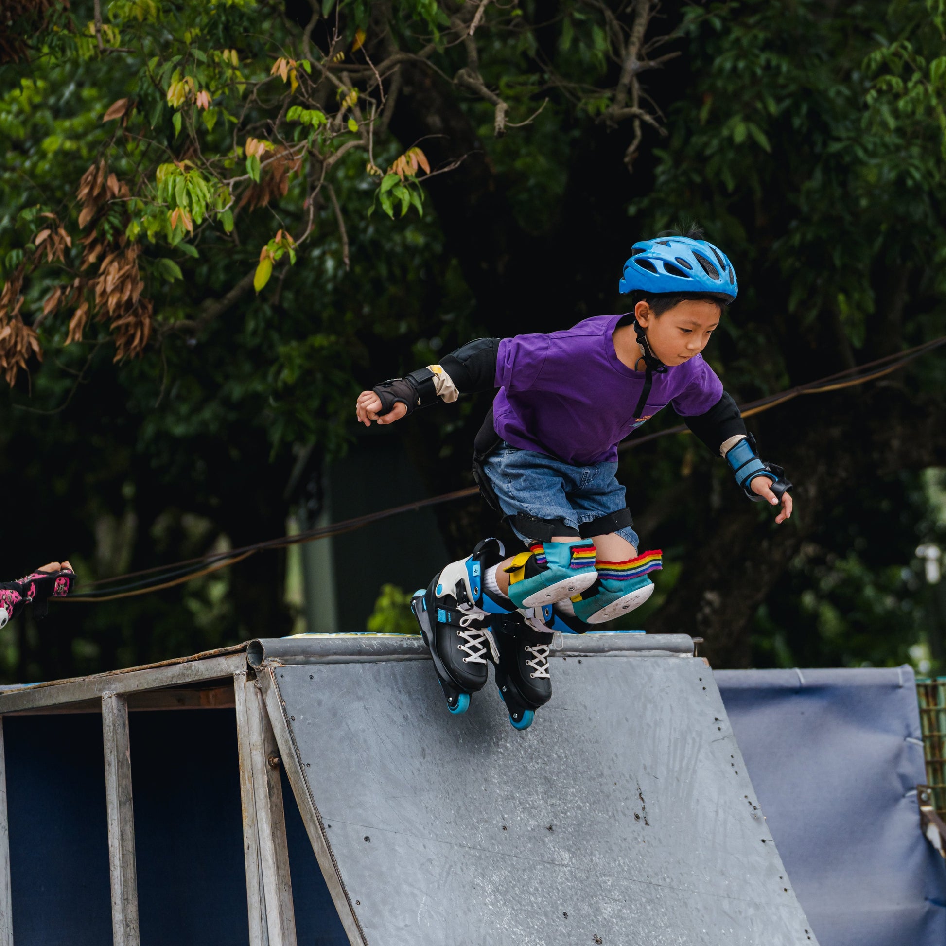 Child rollerblading on a ramp with FlyingEagle VIREO aggressive skates