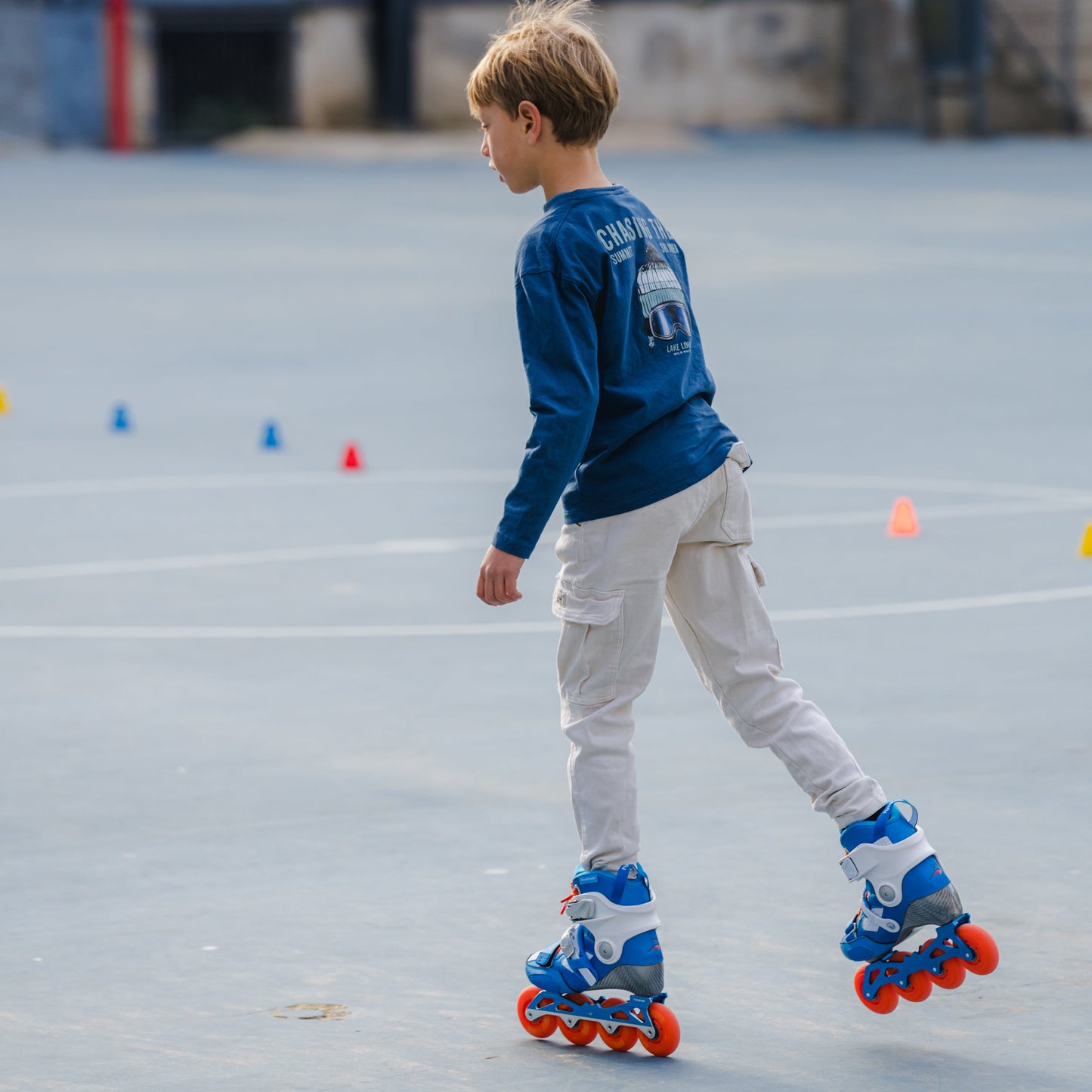Young skater practicing slalom skating with FlyingEagle DRIFT Jr 4 wheels skates