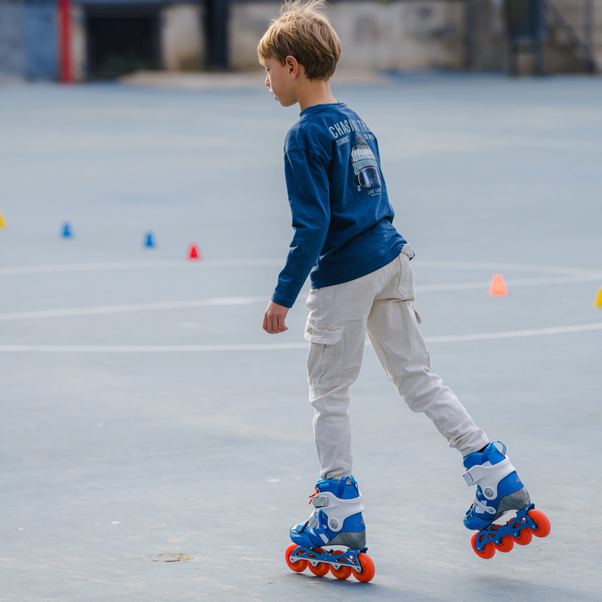 Young skater practicing slalom skating with FlyingEagle DRIFT Jr 4 wheels skates