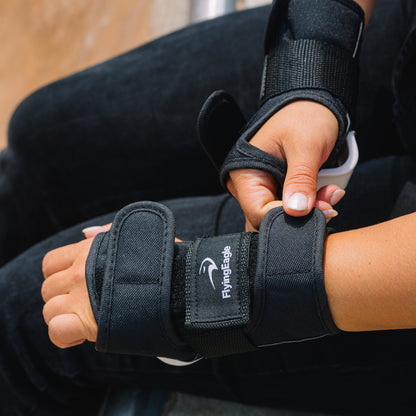 Skater putting on FlyingEagle CORE Wrist Guards for street and park inline skating