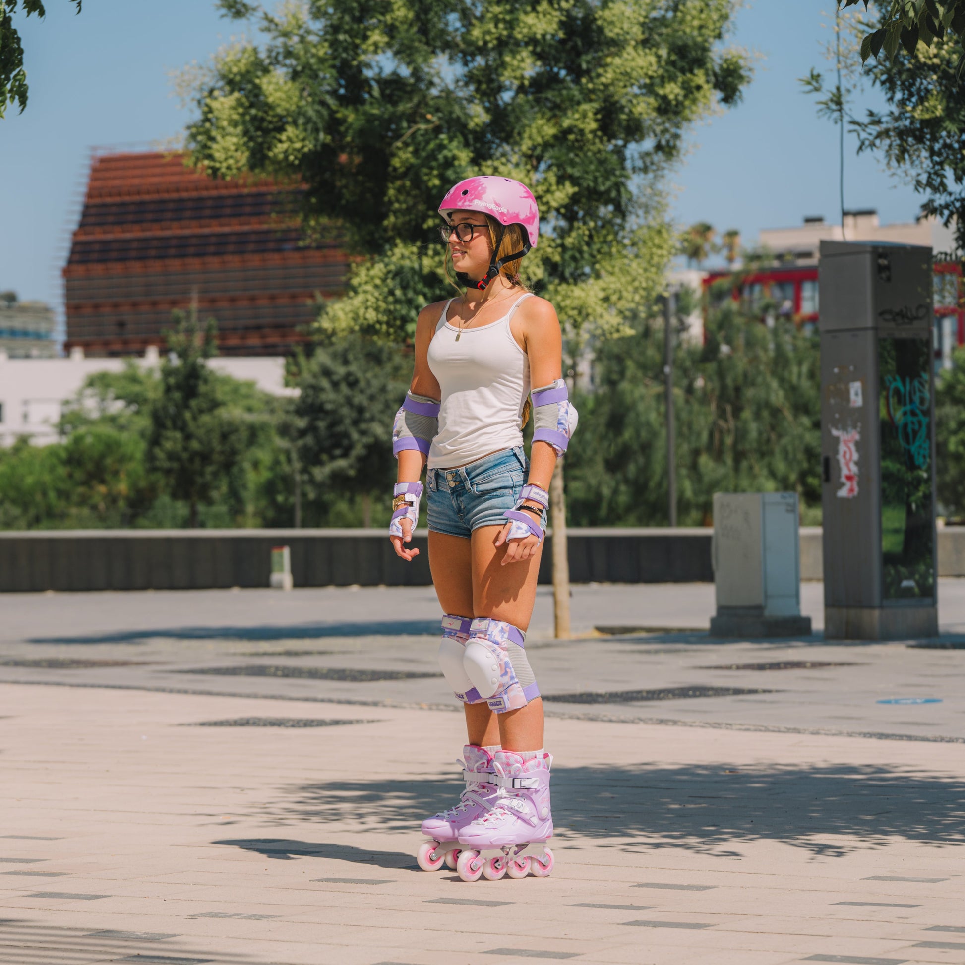 Skater cruising urban flat ground in Flying Eagle SHRIKE mauve adult fitness inline skates four-wheel hard boot design
