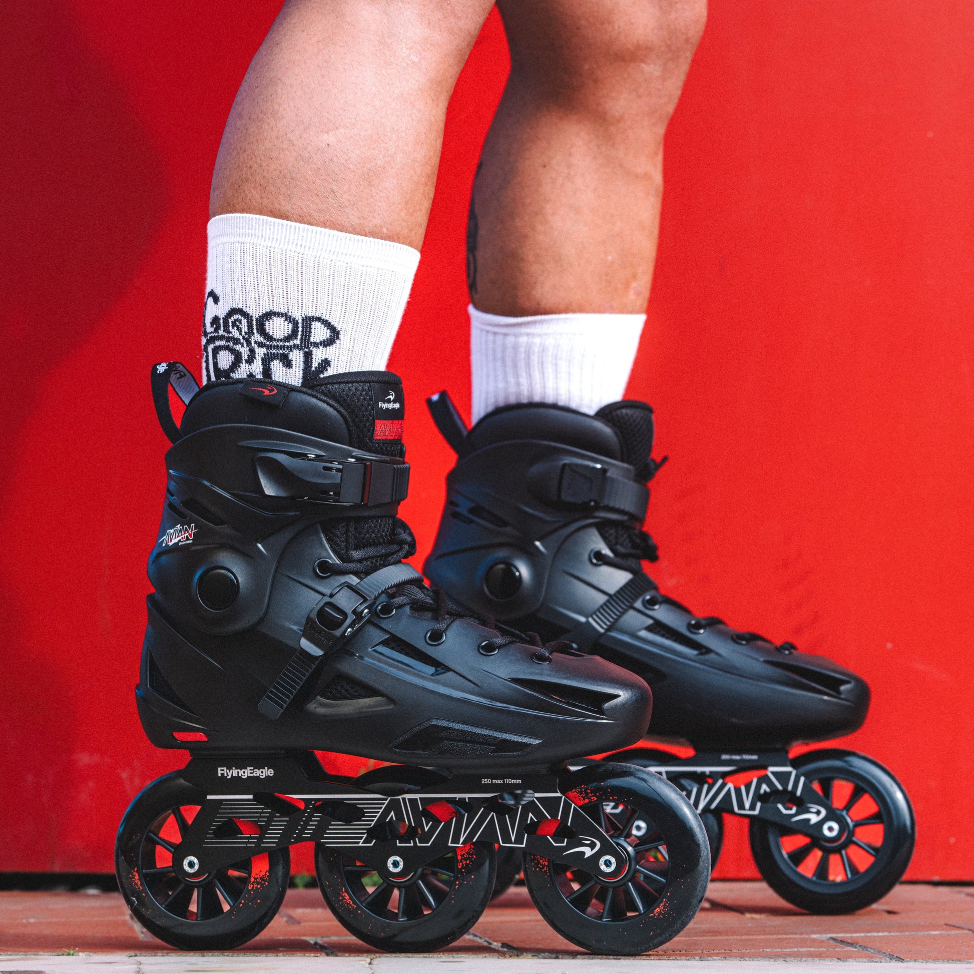 Adult skater cruising urban streets with FlyingEagle AVIAN T110 inline skates