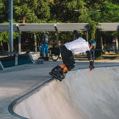 FlyingEagle VIREO, child performing aggressive skating tricks in skate park bowl