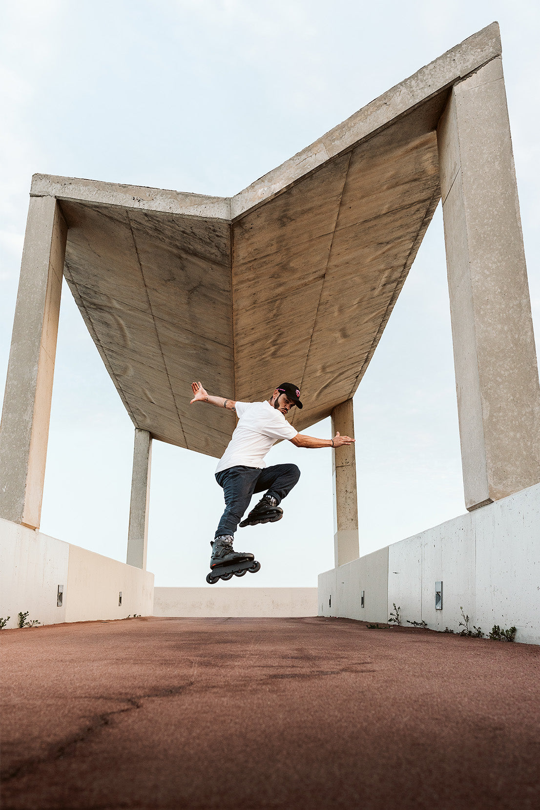Male skater doing jump trick in Flying Eagle hardboot inline skates