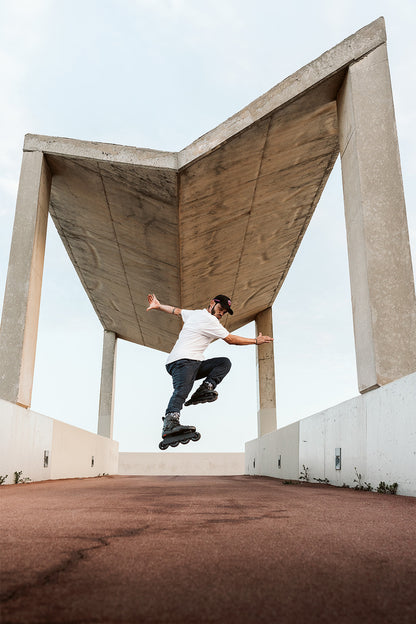Male skater doing jump trick in Flying Eagle hardboot inline skates