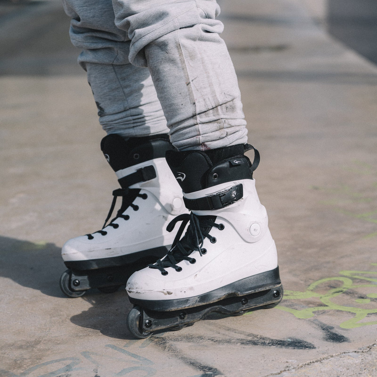 Model wearing Flying Eagle HERON SF60 White aggressive inline skates, white hard boot aggressive skating shoes EU36-45