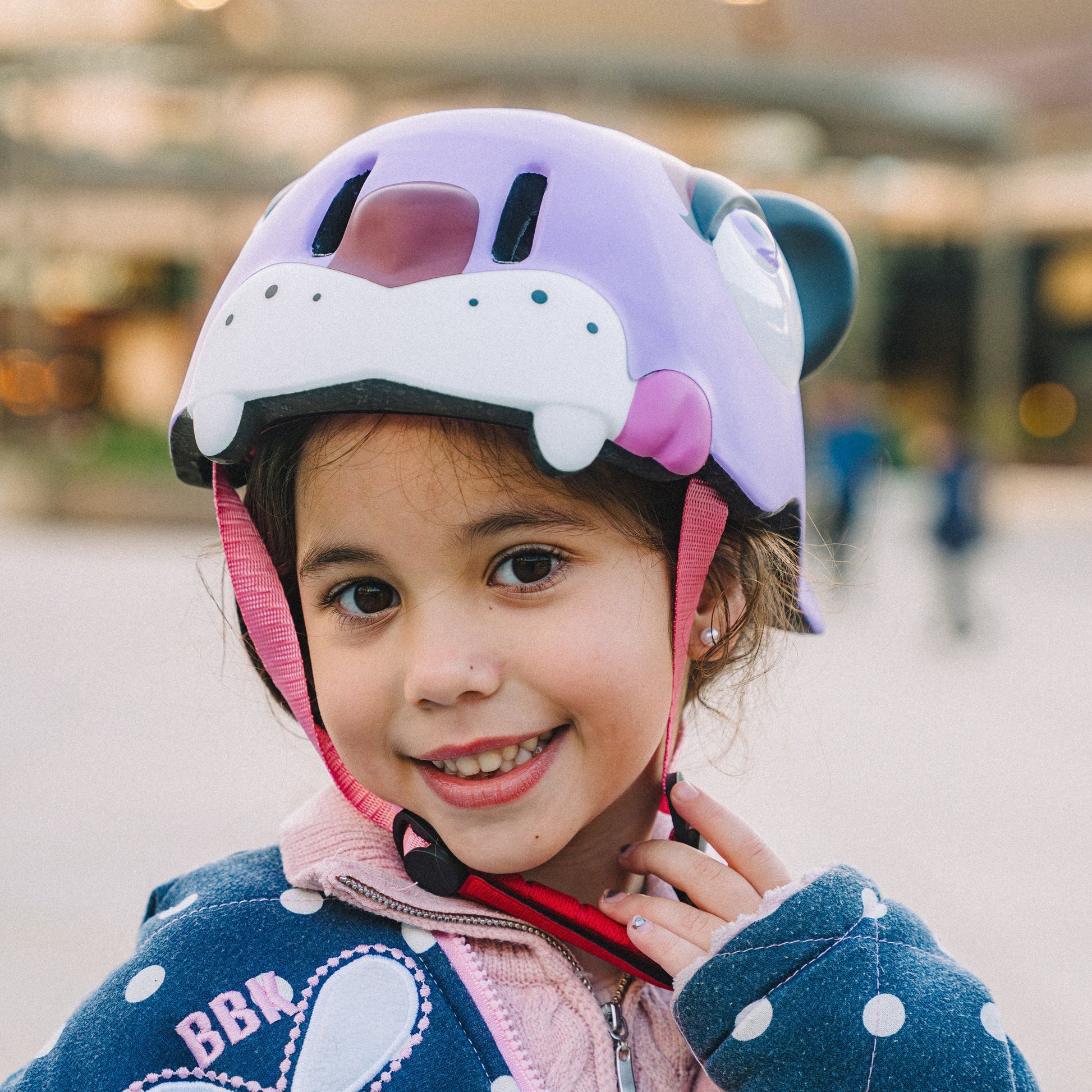 Young skater wearing FlyingEagle KT purple panther helmet playing outdoors