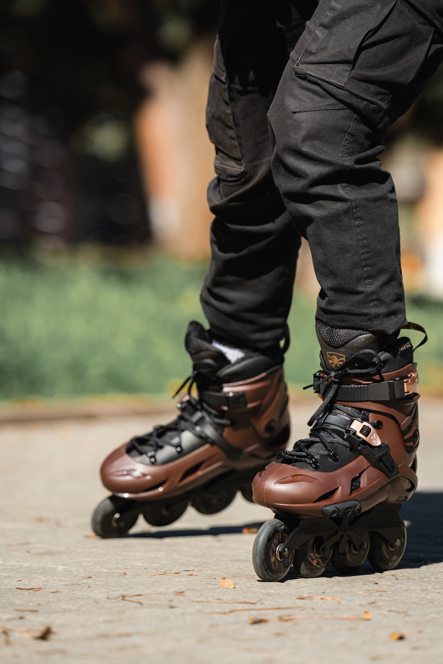 Person wearing blaFlyingEagle Optimum inline skates on a blurred outdoor 