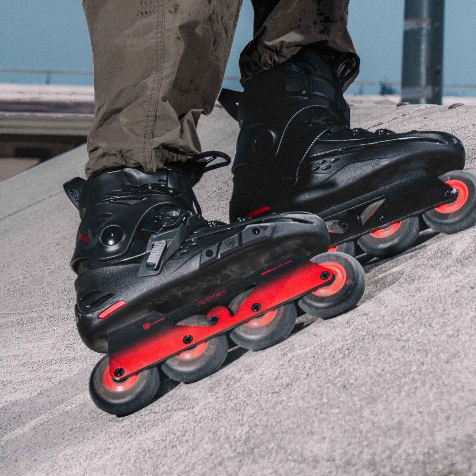 Skater doing power stop slide in Flying Eagle RAVEN black inline skate