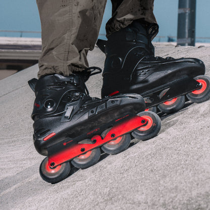 Skater doing power stop slide in Flying Eagle RAVEN black inline skate