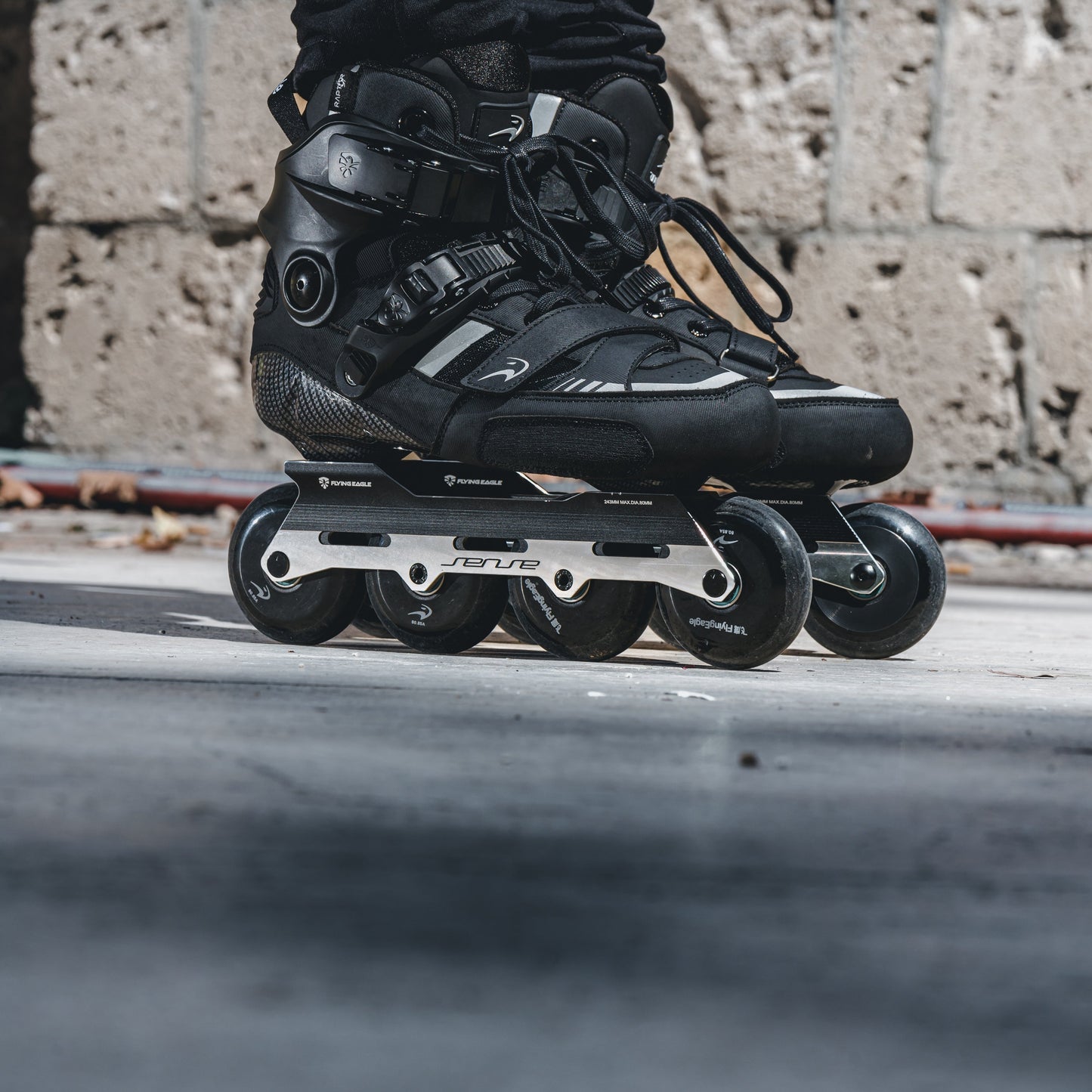 Skater performing street moves on one-piece SENSE black skate frame