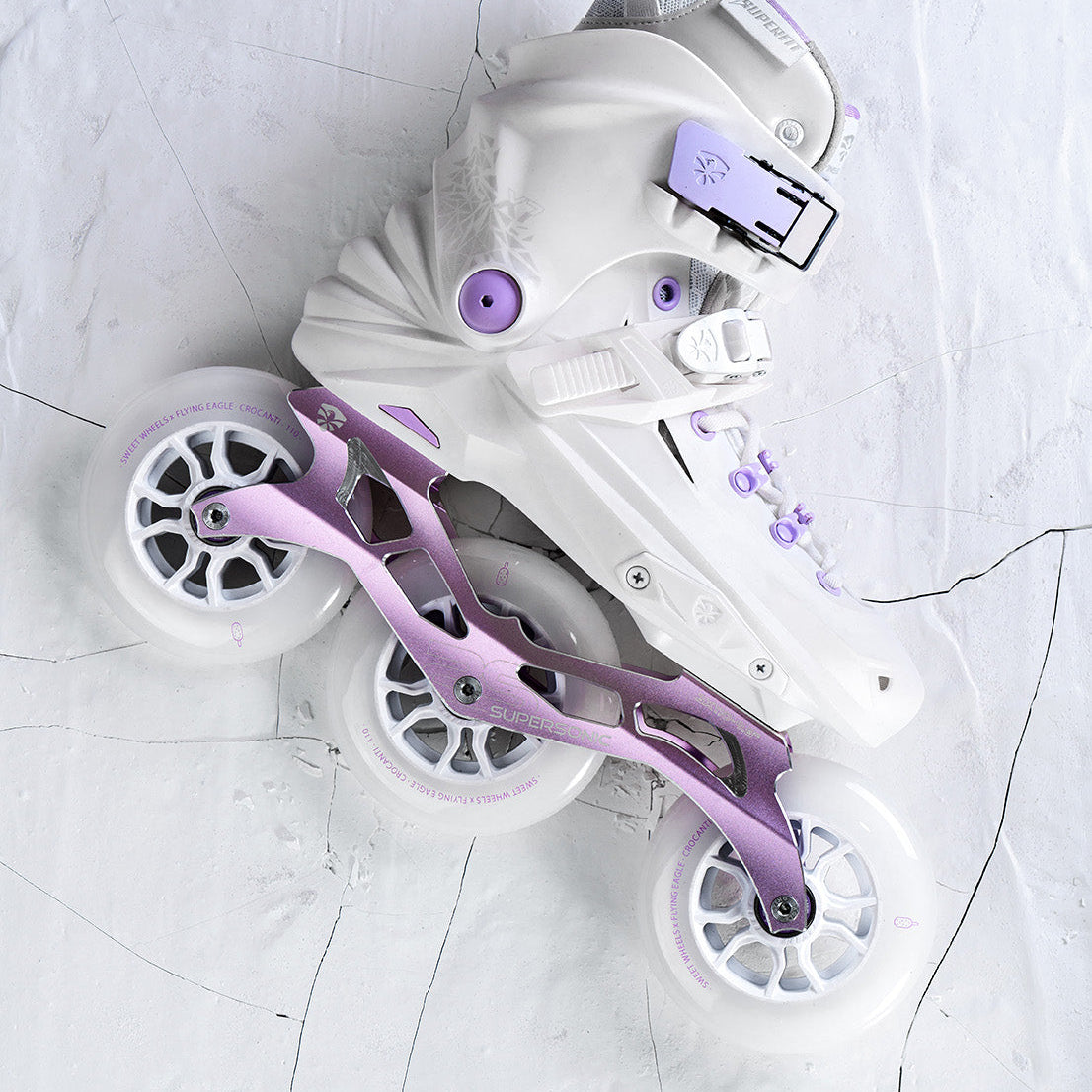 White and purpleFlyingEagle REAVER TRI 3 wheels on a light gray background
