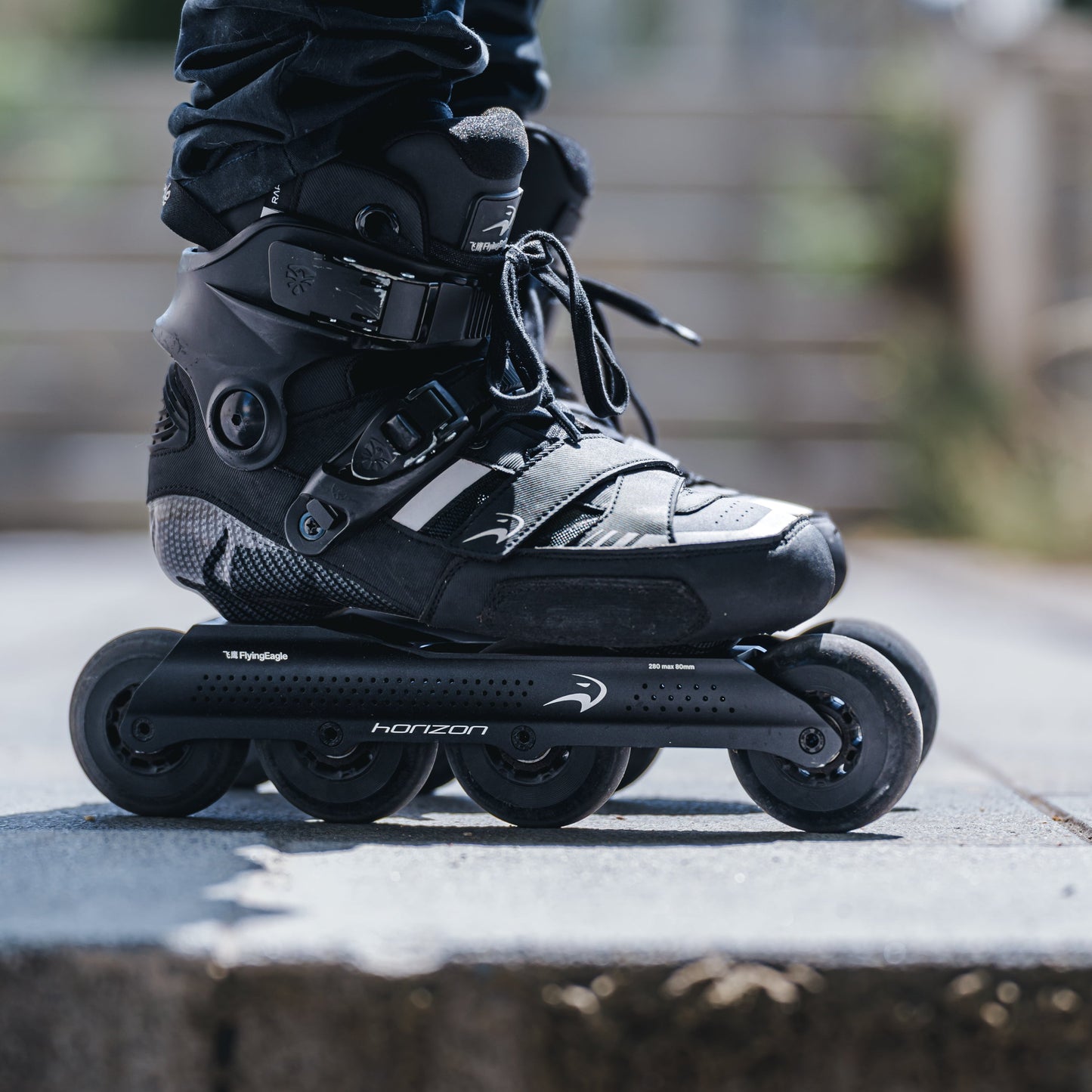 Outdoor skater using HORIZON L80 black frame, enjoying low stance and powerful strides