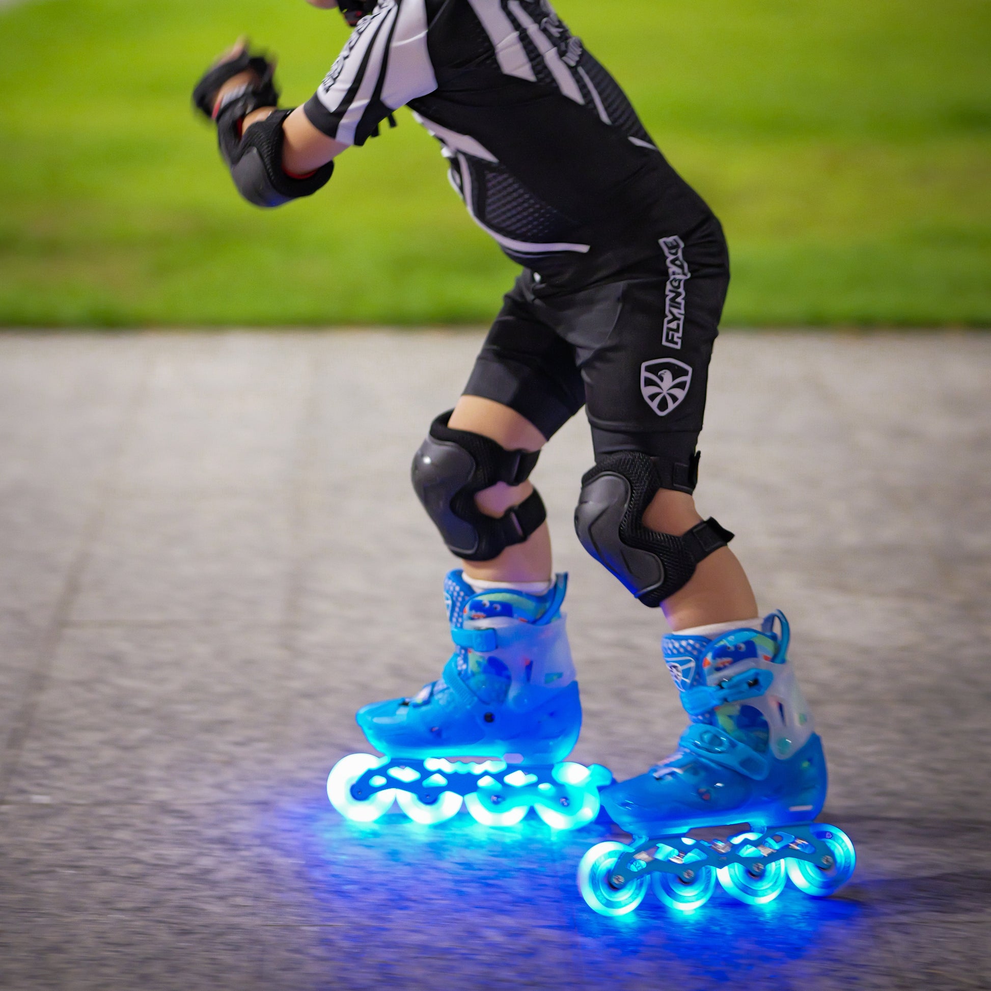 Child enjoying outdoor skating with size-adjustable FlyingEagle LUMAFLY skates LED wheels
