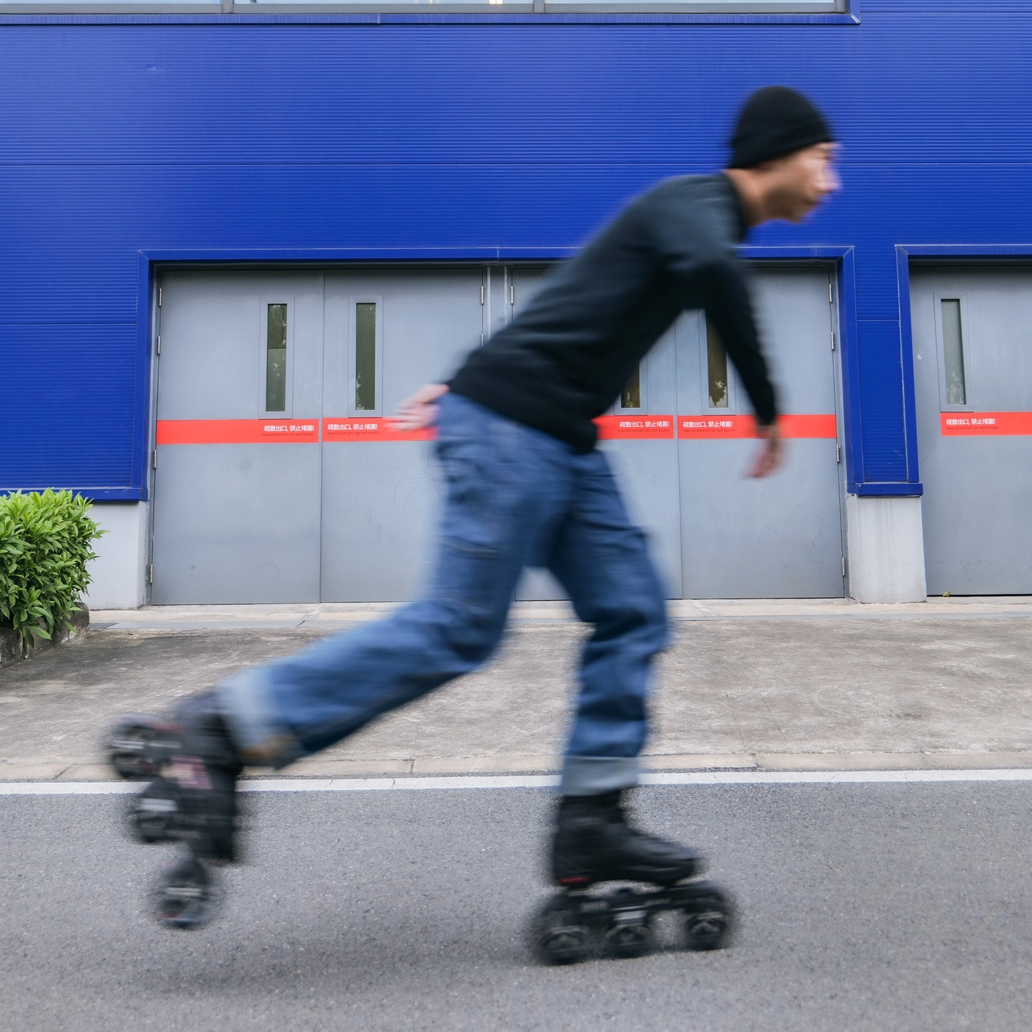 Skater  gliding urban street on Flying Eagle ECLIPSE TRI black 110mm 3‑wheel adult inline skates