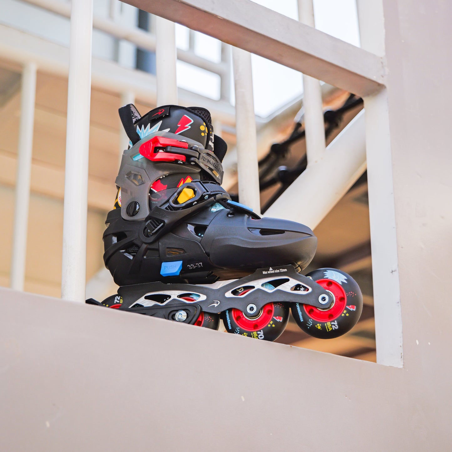 Black and red FlyingEagle S7 PRO NIMBUS inline skate on a staircase