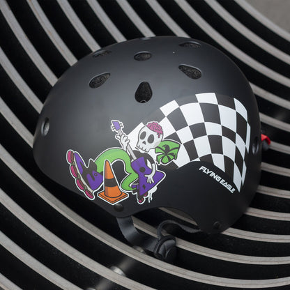 FlyingEagle RIDER JR black helmet displayed on kids recreational park surface