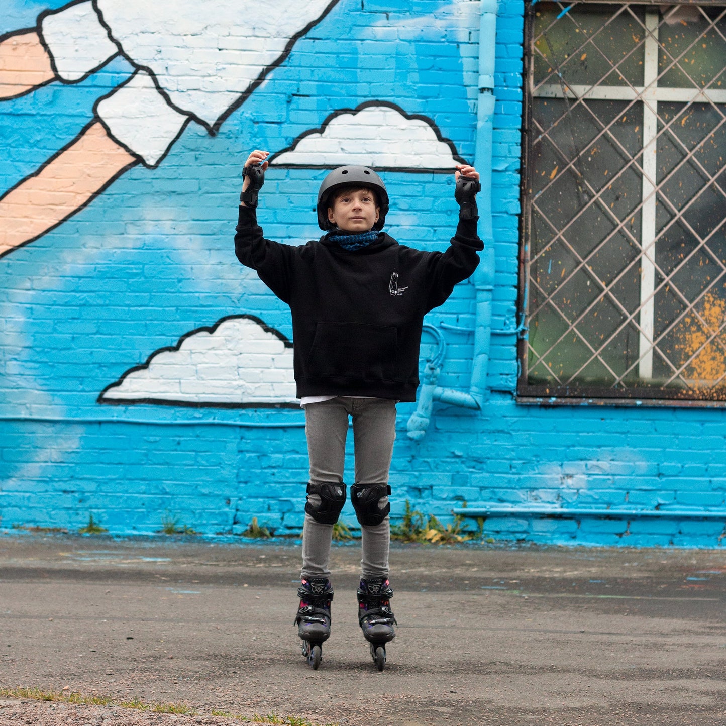 Young kid casually skating outdoors with FlyingEagle SPROUT inline skates