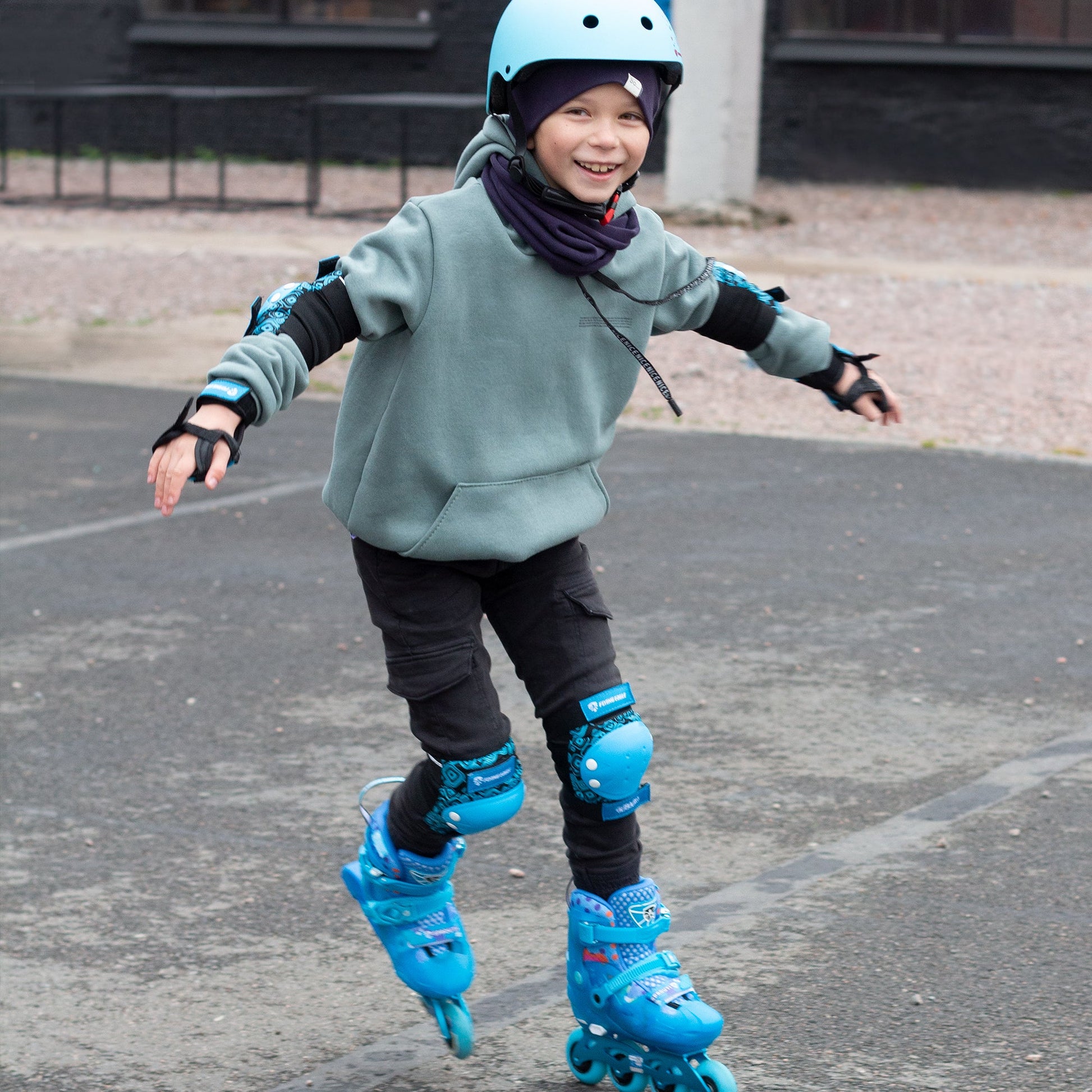 Child playing in urban park wearing size-adjustable FlyingEagle SPROUT skates