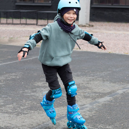 Child playing in urban park wearing size-adjustable FlyingEagle SPROUT skates