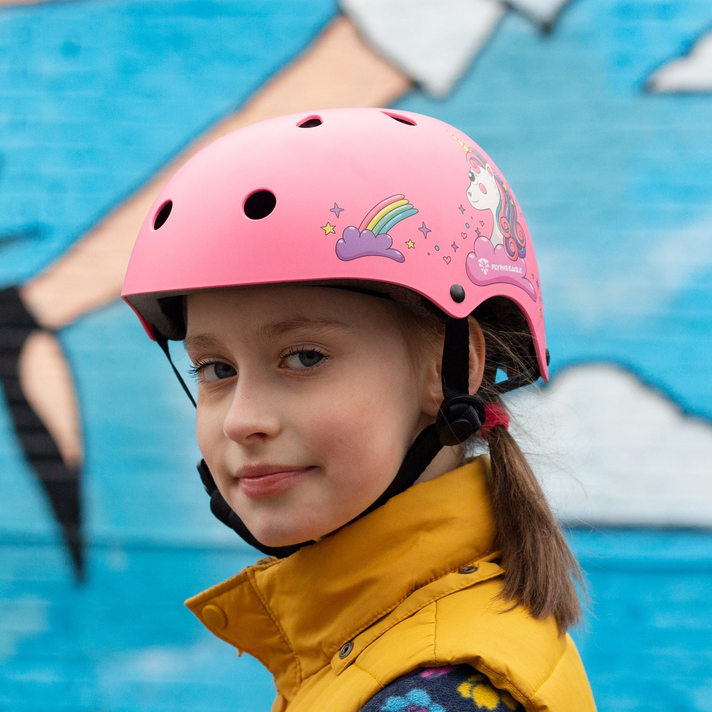 Kid wearing FlyingEagle RIDER JR pink helmet roller skating at children park