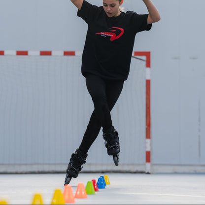 Skater performing slalom moves on inline skates equipped with FlyingEagle CONES bearings