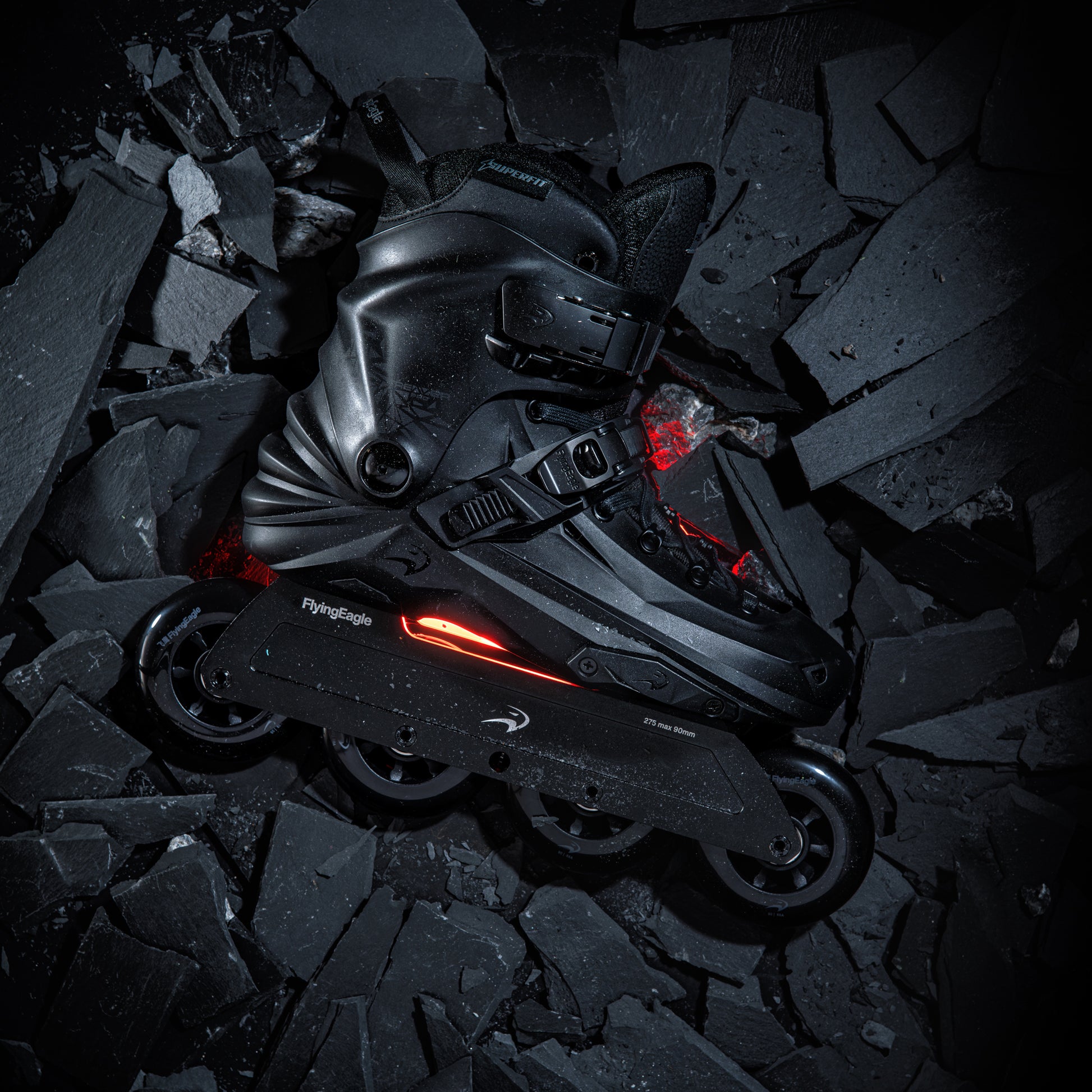FlyingEagle REAVER Pro D8490 Black inline skate with red lights on a dark, textured surface