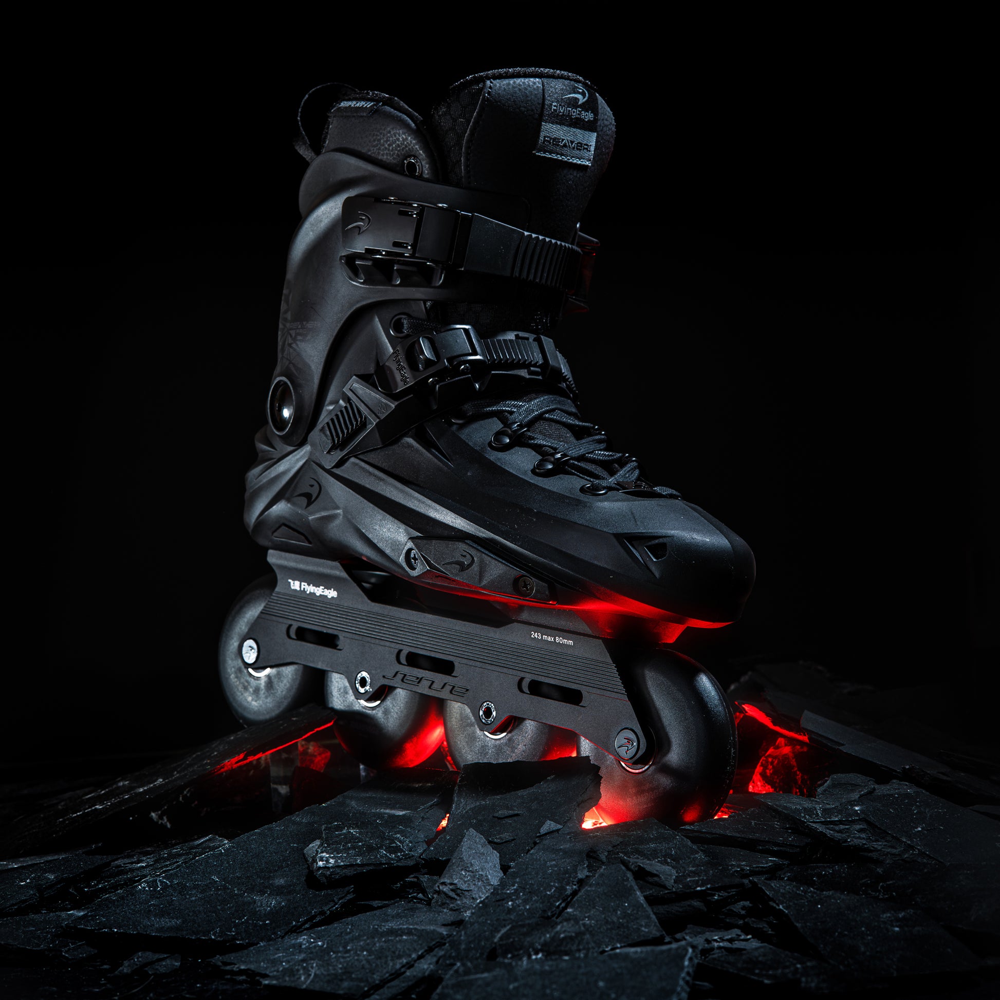 FlyingEagle REAVER Pro S7680 black urban skates placed on rocky ground