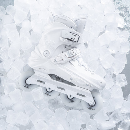 Adult white inline skates FlyingEagle REAVER Pro S7680 laid on multiple ice cubes