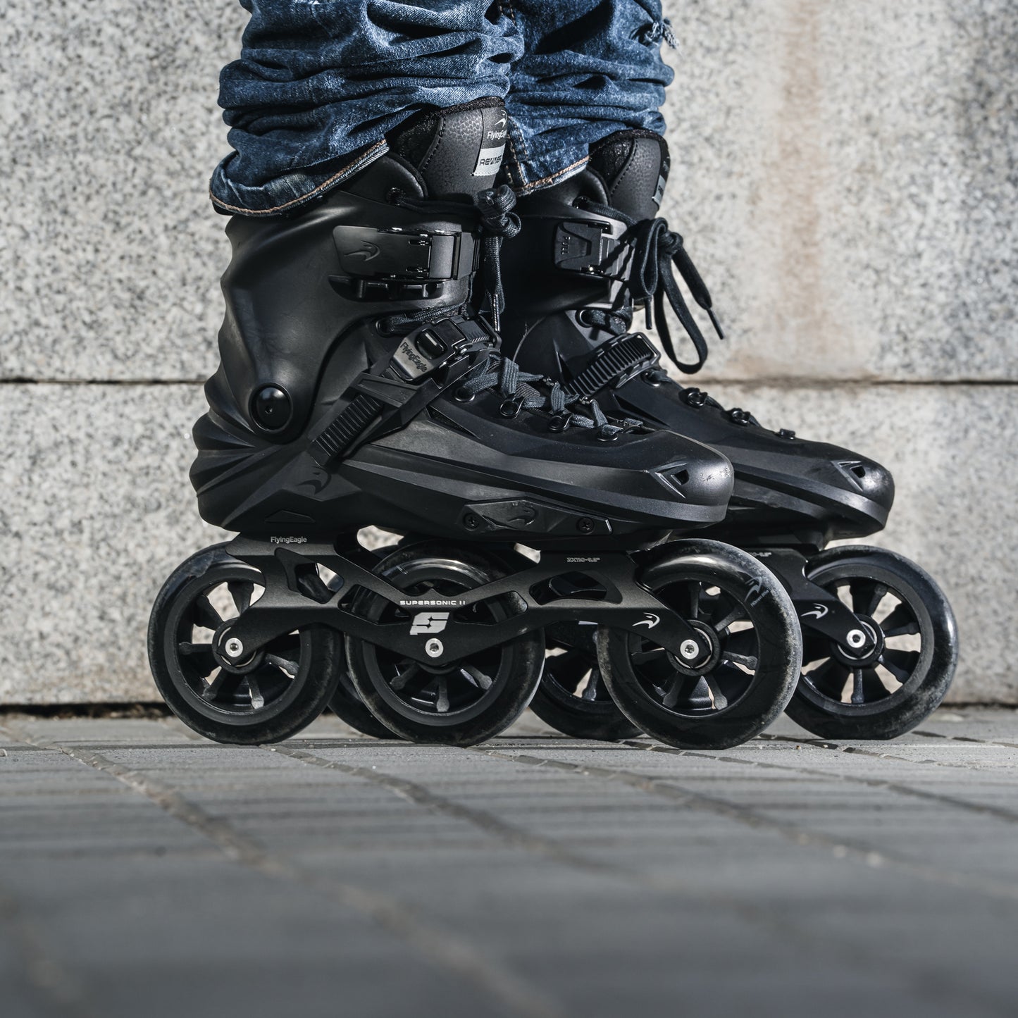 Adult wearing FlyingEagle ReaverPro T110 Black X7T inline skates with 3*110mm wheel.