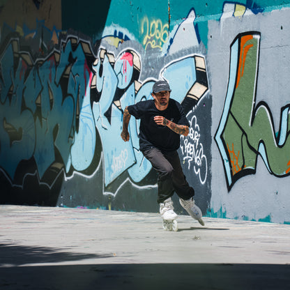 Man riding white large 3-wheel skates, white FlyingEagle ReaverPro T110 for urban skating